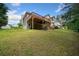 Spacious backyard features a large deck, mature trees, and room for outdoor activities at 405 Maple Rdg, White, GA 30184