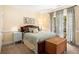 Cozy bedroom with a comfortable queen-sized bed and natural light from a large window at 1884 Whitehawk Ct, Lawrenceville, GA 30043