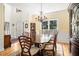 Formal dining room with chandelier, elegant furnishings, and ample natural light at 1884 Whitehawk Ct, Lawrenceville, GA 30043