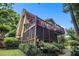 Backyard featuring screened porch, a deck and mature landscaping at 1884 Whitehawk Ct, Lawrenceville, GA 30043
