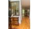 Elegant foyer with hardwood floors, wainscoting, and a decorative mirror at 1884 Whitehawk Ct, Lawrenceville, GA 30043
