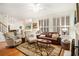 Spacious living room with hardwood floors, neutral decor, and plenty of natural light at 1884 Whitehawk Ct, Lawrenceville, GA 30043