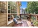 Relaxing patio area with comfortable seating and a view of the landscaped backyard at 1884 Whitehawk Ct, Lawrenceville, GA 30043
