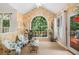 Bright sun room with vaulted ceilings, large windows, and access to the outdoor deck at 1884 Whitehawk Ct, Lawrenceville, GA 30043