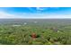 Aerial view showing the home surrounded by a dense forest at 3088 Hiram Sudie Road, Hiram, GA 30141