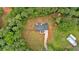 Aerial view highlights the large lot with treed surround and the location of the white farmhouse at 3088 Hiram Sudie Road, Hiram, GA 30141