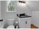 Upstairs bathroom featuring a granite countertop, modern faucet, and updated vanity at 3088 Hiram Sudie Road, Hiram, GA 30141