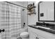 Charming bathroom with black fixtures, subway tile, and a decorative floor design at 3088 Hiram Sudie Road, Hiram, GA 30141