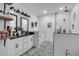 Bright bathroom featuring double sinks, modern fixtures, and a glass-enclosed shower at 3088 Hiram Sudie Road, Hiram, GA 30141