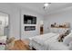 Bright bedroom with a tray ceiling, fireplace, and hardwood floors at 3088 Hiram Sudie Road, Hiram, GA 30141