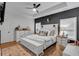 Main bedroom with a large bed, accent wall, and neutral decor at 3088 Hiram Sudie Road, Hiram, GA 30141