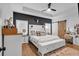 Stylish main bedroom featuring a tray ceiling, barn door, and a dark accent wall at 3088 Hiram Sudie Road, Hiram, GA 30141