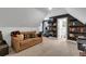 Cozy bonus room with comfortable seating, shelving, and access to a bathroom at 3088 Hiram Sudie Road, Hiram, GA 30141