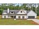 Charming two-story white farmhouse with black trim, dark roof, and a welcoming front porch at 3088 Hiram Sudie Road, Hiram, GA 30141