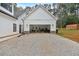 Exterior view of the detached garage and gravel driveway of this modern farmhouse home at 3088 Hiram Sudie Road, Hiram, GA 30141