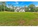 Lush green lot with a charming white farmhouse featuring dark accents and ample natural light at 3088 Hiram Sudie Road, Hiram, GA 30141