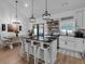 Open concept kitchen with island seating and a dining area, perfect for entertaining at 3088 Hiram Sudie Road, Hiram, GA 30141