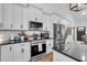 Well-equipped kitchen with stainless steel appliances and a breakfast bar at 3088 Hiram Sudie Road, Hiram, GA 30141
