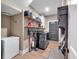 Laundry room with modern appliances, open shelving, and a convenient layout at 3088 Hiram Sudie Road, Hiram, GA 30141