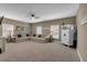 Spacious living room featuring a large sectional sofa, multiple windows, and modern decor at 3088 Hiram Sudie Road, Hiram, GA 30141