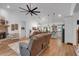 Open living room featuring a brick fireplace, wood floors, and seamless flow at 3088 Hiram Sudie Road, Hiram, GA 30141
