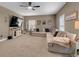Comfortable living room with plush sectional sofa, TV, and ample natural light at 3088 Hiram Sudie Road, Hiram, GA 30141