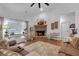 Bright living room with a brick fireplace and comfortable seating at 3088 Hiram Sudie Road, Hiram, GA 30141