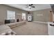 Relaxing living room with a large sectional sofa, modern decor, and plentiful natural light at 3088 Hiram Sudie Road, Hiram, GA 30141