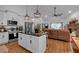 Modern open concept kitchen flows into the living room for seamless entertaining at 3088 Hiram Sudie Road, Hiram, GA 30141