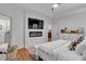 Main bedroom with a tray ceiling and electric fireplace, providing a cozy ambiance at 3088 Hiram Sudie Road, Hiram, GA 30141