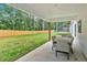 Covered outdoor patio with dining set, perfect for entertaining with a view of the spacious fenced yard at 3088 Hiram Sudie Road, Hiram, GA 30141