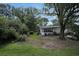 The shaded backyard features green lawn and mature trees at 3835 Clearwater Dr, Atlanta, GA 30349