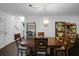 Formal dining room featuring a stylish chandelier and a large wooden table at 3835 Clearwater Dr, Atlanta, GA 30349