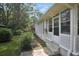 The home's sunroom has plentiful windows and a peaceful view at 3835 Clearwater Dr, Atlanta, GA 30349