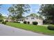 Inviting two-story home with a lush green lawn, side garage, and charming curb appeal at 3835 Clearwater Dr, Atlanta, GA 30349