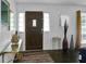 The foyer has a striking wooden door with a glass pane to let light in at 3835 Clearwater Dr, Atlanta, GA 30349