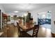 Open-concept kitchen and dining area with modern appliances and ample seating at 3835 Clearwater Dr, Atlanta, GA 30349