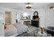 Bright living area with a Murphy bed, adjacent kitchenette, and neutral decor at 3835 Clearwater Dr, Atlanta, GA 30349