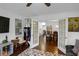 Open-concept living room with french doors leading to the dining room at 3835 Clearwater Dr, Atlanta, GA 30349