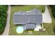 An aerial view displays a lovely home with an inviting backyard featuring an above ground pool and landscaped areas at 188 Macedonia Rd, White, GA 30184