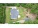 An aerial view of a lovely home with an inviting backyard featuring an above ground pool and beautifully landscaped areas at 188 Macedonia Rd, White, GA 30184