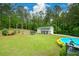 Well-maintained backyard with pool and view of outbuilding at 188 Macedonia Rd, White, GA 30184