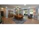 Open-concept dining area with elegant furnishings, seamlessly blending into the living space and leading to an outdoor patio at 188 Macedonia Rd, White, GA 30184