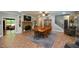Open dining area features a brick fireplace, built in shelving, and views to the living room at 188 Macedonia Rd, White, GA 30184