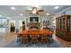 Open concept dining area has built-in shelves, a brick fireplace, and a view to the kitchen at 188 Macedonia Rd, White, GA 30184