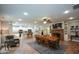 Open floor plan view shows the kitchen, dining table, and living room with brick fireplace at 188 Macedonia Rd, White, GA 30184