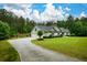 Beautiful single-story home featuring a long driveway, two-car garage, and well-manicured front lawn at 188 Macedonia Rd, White, GA 30184