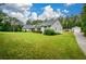 This is a full property view showcasing the home and an outbuilding at 188 Macedonia Rd, White, GA 30184