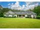 Well-maintained single-story home with a lush green lawn and covered front porch perfect for relaxing at 188 Macedonia Rd, White, GA 30184