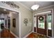Inviting foyer with hardwood floors, decorative wreath, and a view into other rooms at 188 Macedonia Rd, White, GA 30184